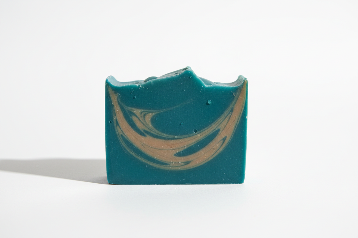 Soap bar in teal with light brown streaks
