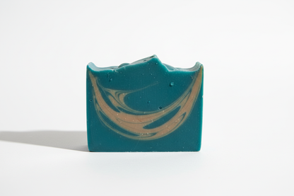 Soap bar in teal with light brown streaks